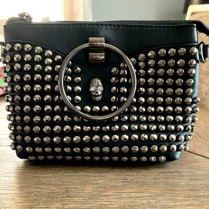 Black studded handbag with skull detail